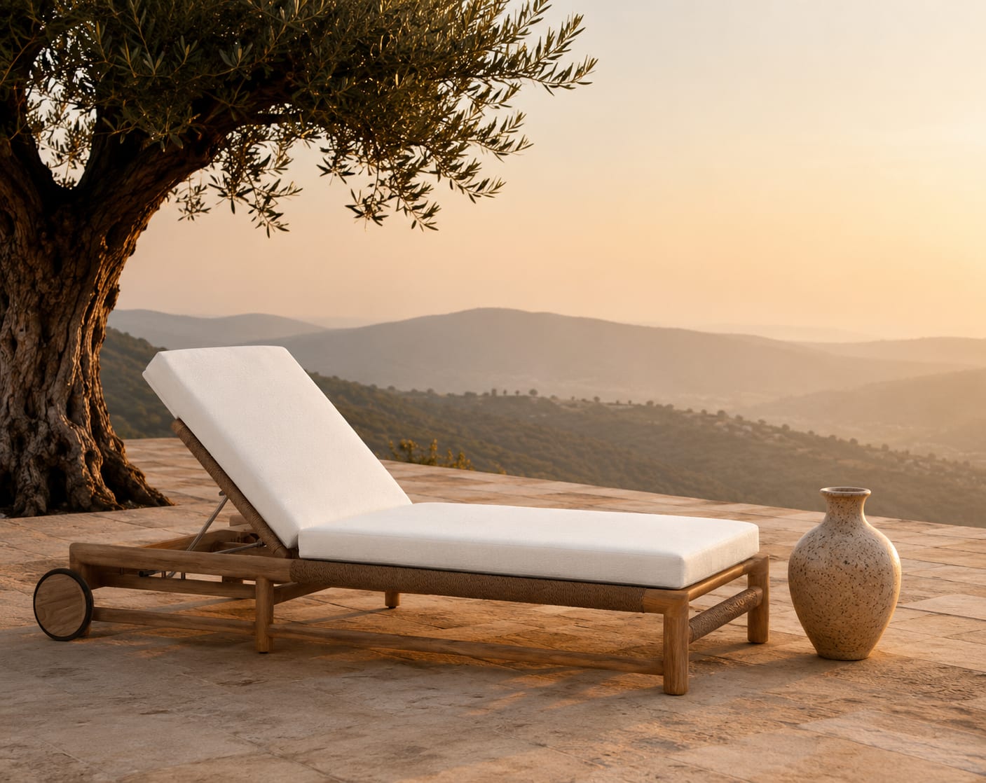 A weathered teak lounger beneath an old olive tree, late afternoon
